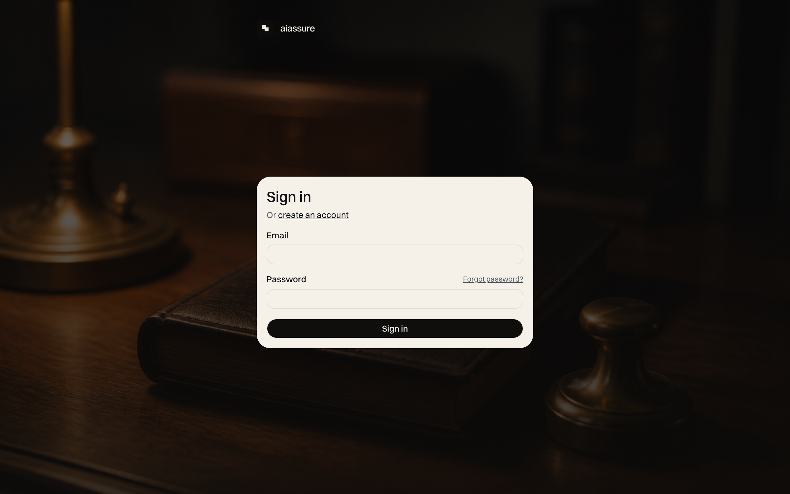 aiassure sign-in screen over a desk photograph